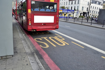 Naklejka na ściany i meble Double Decker red bus is running on road in London
