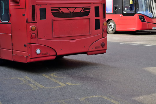 Double Decker red bus is running on road in London