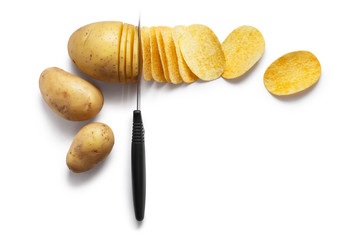 Knife cutting potatoe into chips, isolated on white background, view from above