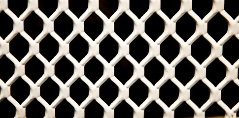 White grille. Black background