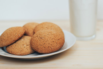 Cookies with a glass of milk on the table.