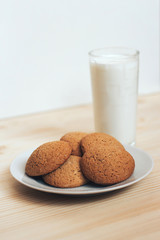 Cookies with a glass of milk on the table.