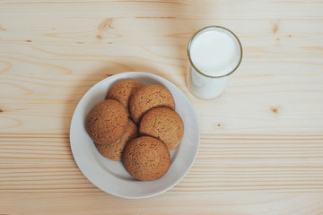 Cookies with a glass of milk on the table.