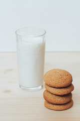 Cookies with a glass of milk on the table.