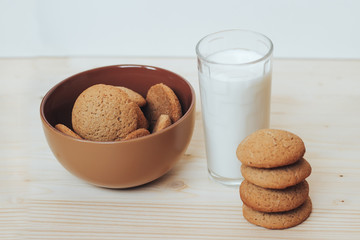 Cookies with a glass of milk on the table.
