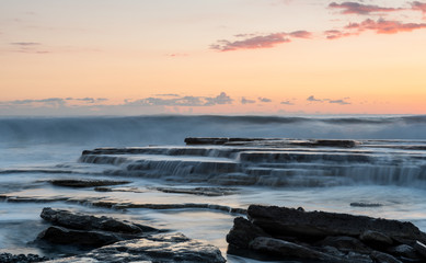 Fototapeta premium Beautiful dramatic Sunset over a rocky coast
