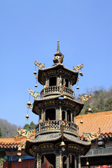copper incense burner in a temple