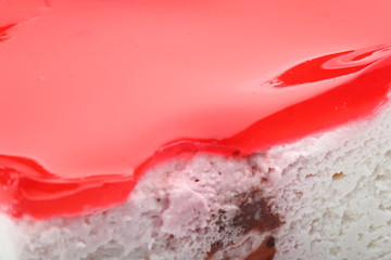 Red jelly on a cake close-up