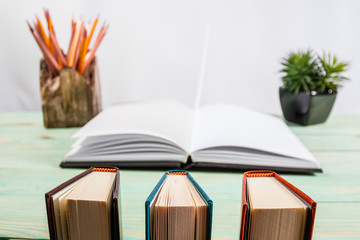 Pile of books on wooden background