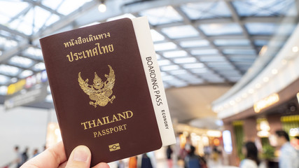 Holding passports and boarding pass 1