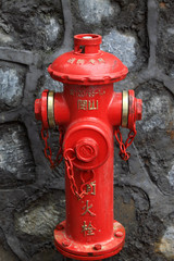 Fototapeta na wymiar red fire hydrant in the street
