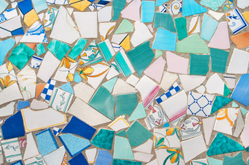 broken pieces of ceramic tiled on wall