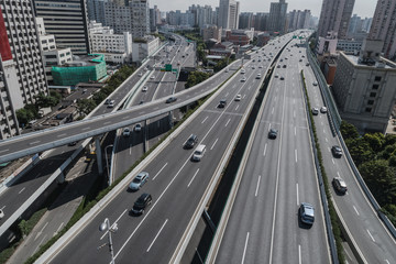 Aerial view of highway and overpass in city on sunny day