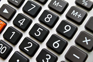 Business, finance, savings money, investment, taxes or accounting concept : Close up of black button calculator