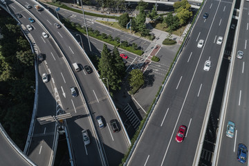 Aerial view of highway and overpass in city on sunny day