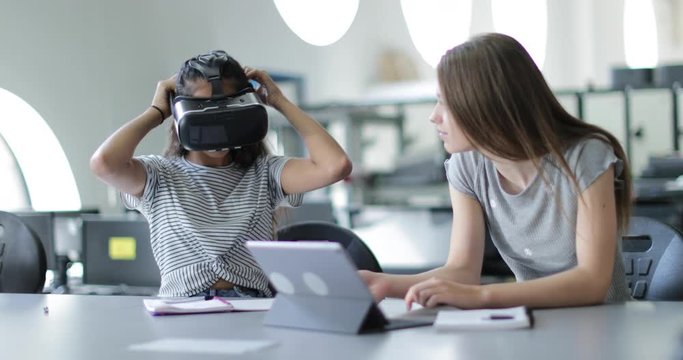 High school students using VR headset in class