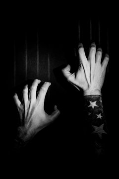 Fingernails Scratching Down a Black Wall