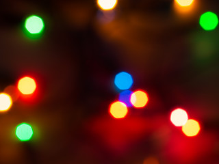 Detail of a Christmas lights abstract background on black