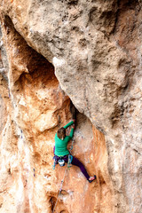 A rock climber on a rock.