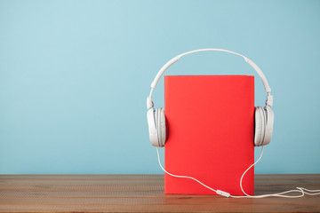 Audiobook concept with book and headphones