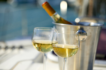 Pair of wineglasses against the yacht