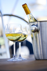 Pair of wineglasses against the yacht