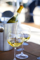 Pair of wineglasses against the yacht