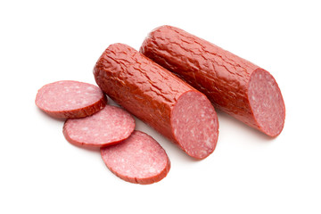 Salami smoked sausage, basil leaves on white background cutout.