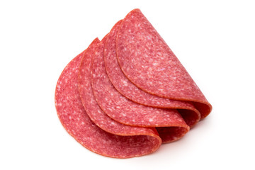 Salami slices isolated on the white background.