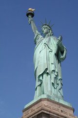Fototapeta na wymiar Statue of Liberty - Blue Sky Background