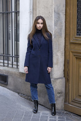 Fashion portrait of young beautiful woman in Paris.