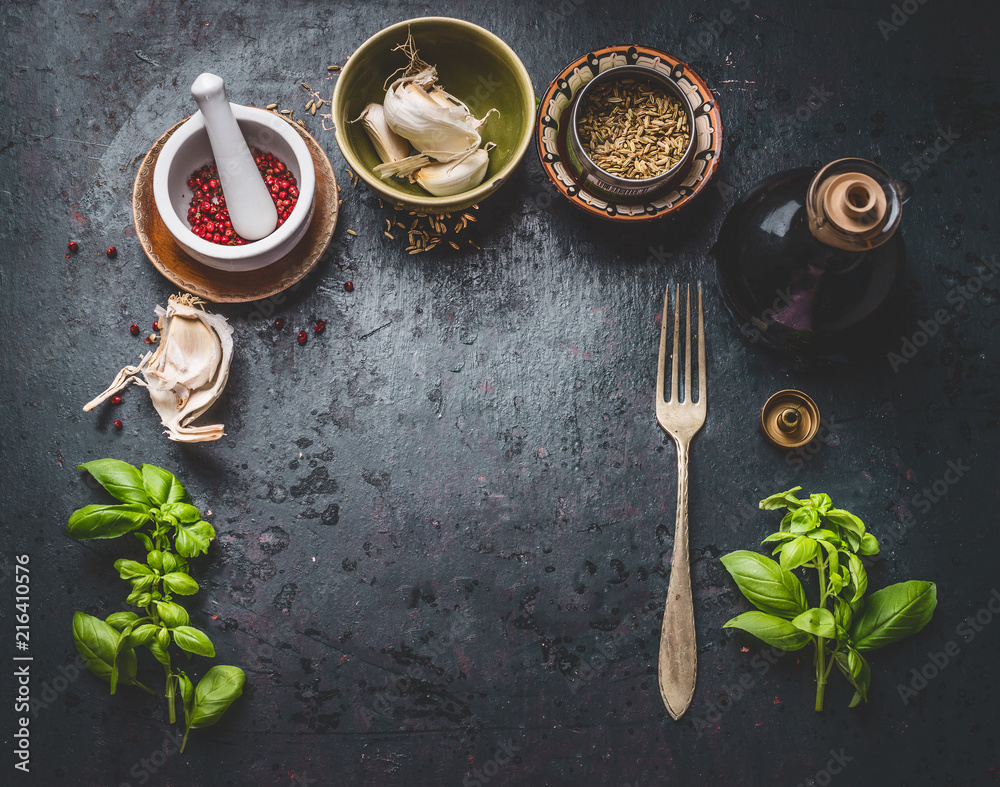 Sticker dark rustic aged food background with fork, bowls of herbs, spices and seasoning, top view with copy