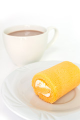 orange cake roll on white plate and cup chocolate on white background.