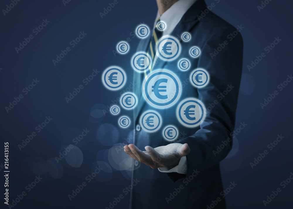 Wall mural growing money concept for business investment and finance. businessman holding money coin icons (eur