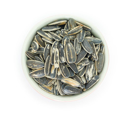 seed sunflower in bowl top view on white background.