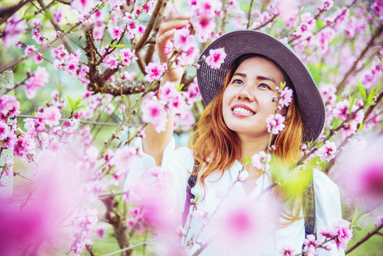 woman asian travel nature. Travel relax. photographed in a flower garden.