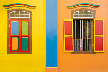 Colorful wooden window Colonial style architecture building in Little India, Singapore City.