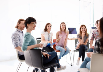 Young people having business training in office