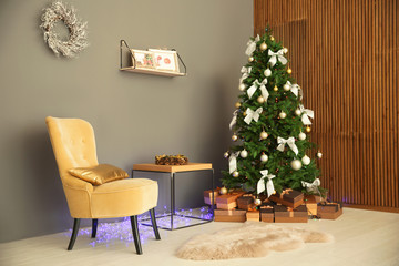 Room interior with beautiful Christmas tree and gifts