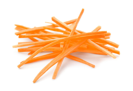 Cut ripe carrot on white background