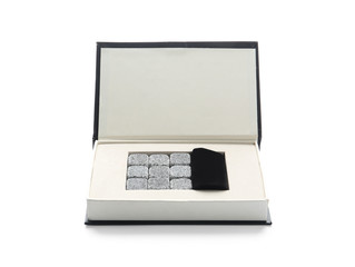 Box with whiskey stones on white background