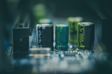 selective focus effect and macro view of the group of electronic components on mainboard circuit...