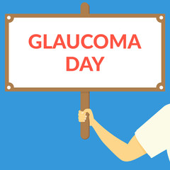 GLAUCOMA DAY. Hand holding wooden sign