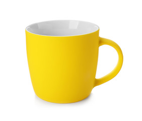 Yellow ceramic cup isolated on white