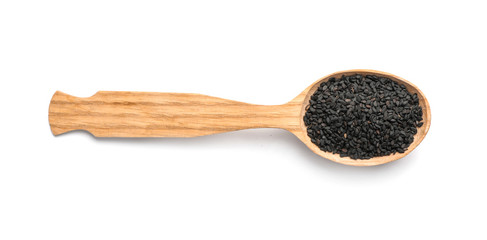 Wooden spoon with black sesame on white background. Different spices