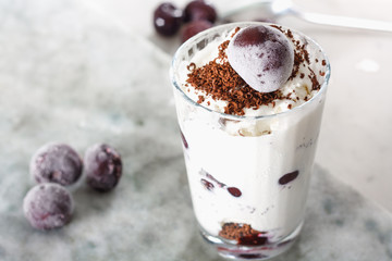 Ice cream with cherry berries on  marble countertop background