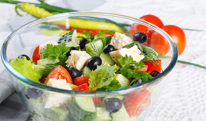 Salad of fresh vegetables and cheese on  served table