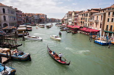Fototapeta na wymiar VENICE, ITALY: The gondolier floats in the Venetian lagoon.