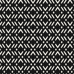 Vector geometric seamless pattern with zig zag lines, stripes, rhombuses. Modern abstract black and white repeat texture. Stylish dark monochrome background in ethnic style. Repeat design element
