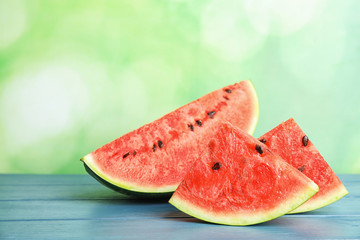 Fresh juicy watermelon with seeds on wooden table